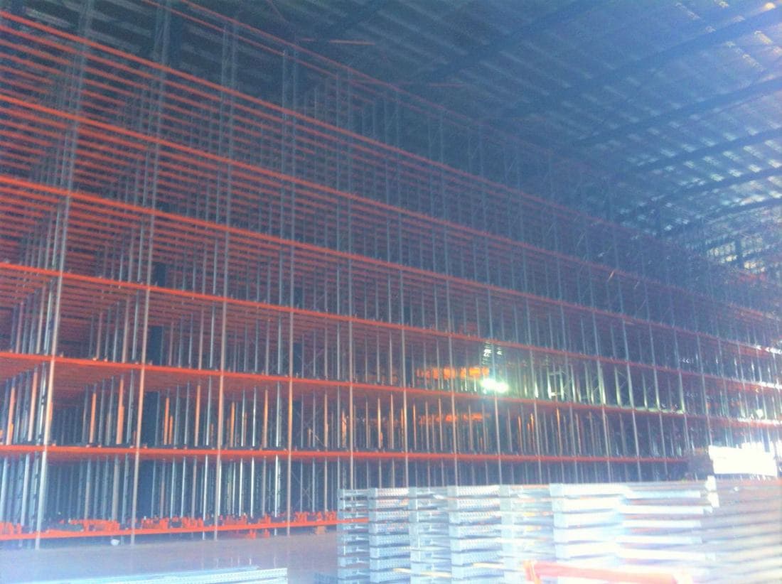 High-bay pallet racking installation during fit-out